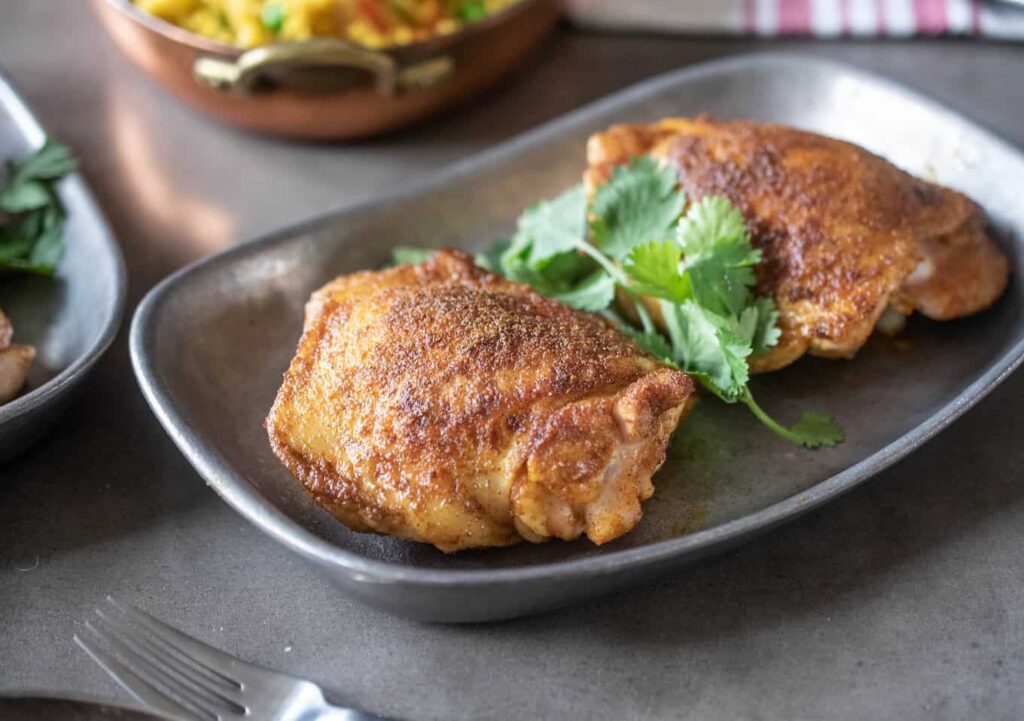 Paha ayam direndam dengan bumbu India